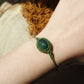 Makramee Armband mit geräuchertem Opal in Moosgrün