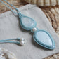 Handgeknüpfte Makramee Kette „Mut“ mit weißem Labradorit, blauem Opal und Süßwasserperle.